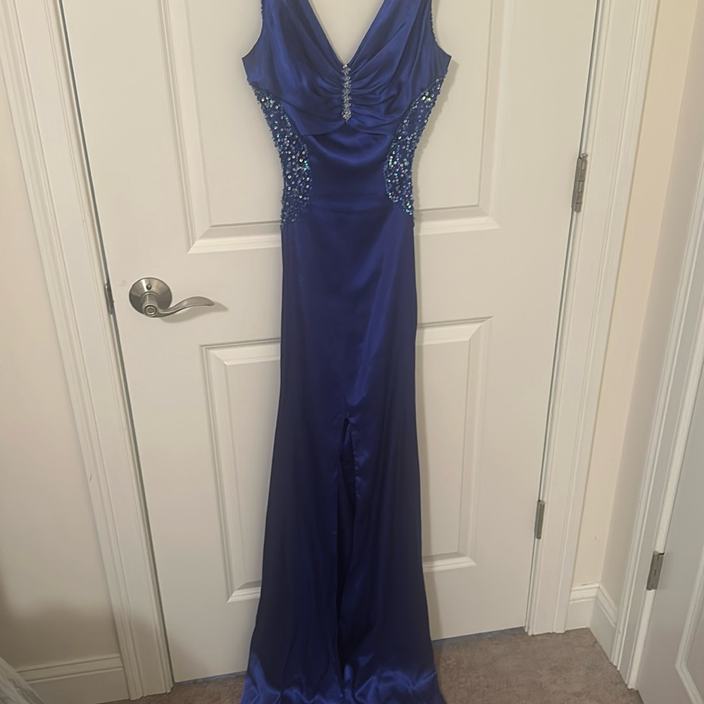Gorgeous royal blue Jovani gown cut out in the front tail open back in the back